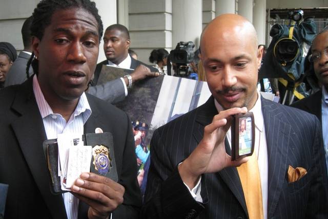 Jumaane Williams and Kirsten John Foy showing the offical IDs they showed cops before their arrest.